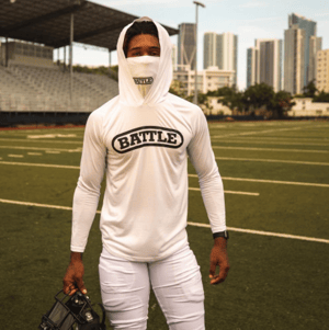 Football player wearing a Battle Sports lightweight hoodie with face mask