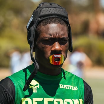 football player with rainbow mouthguard