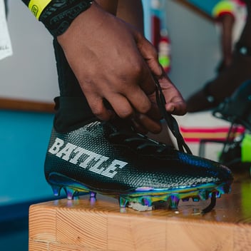 football cleats with battle sports logo