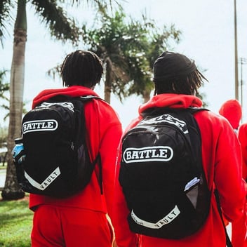 football players wearing Battle backpacks