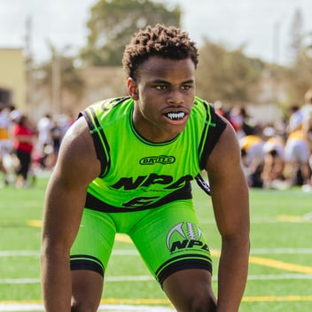 Football player showing fangs mouthguard